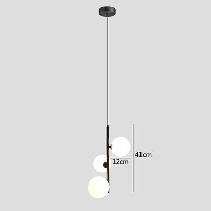 Modern brass and black glass ball pendant light dining room