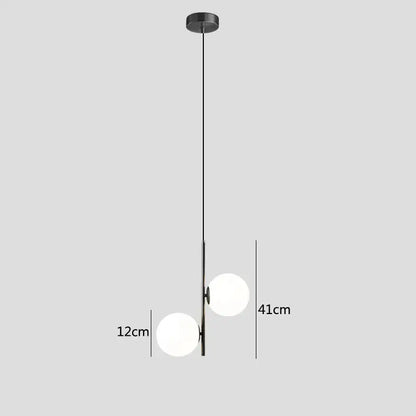 Modern brass and black glass ball pendant light dining room