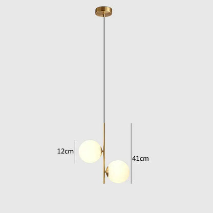 Modern brass and black glass ball pendant light dining room