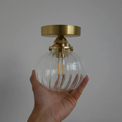 Modern brass and blue glass ball wall sconce with pull chain bedroom