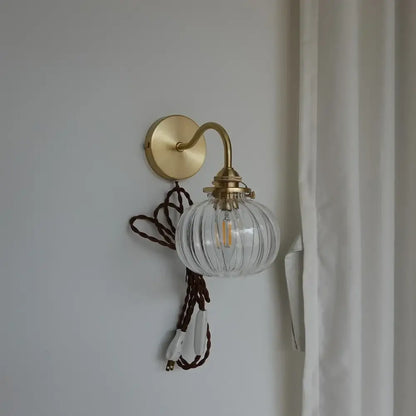Modern brass and blue glass ball wall sconce with pull chain bedroom