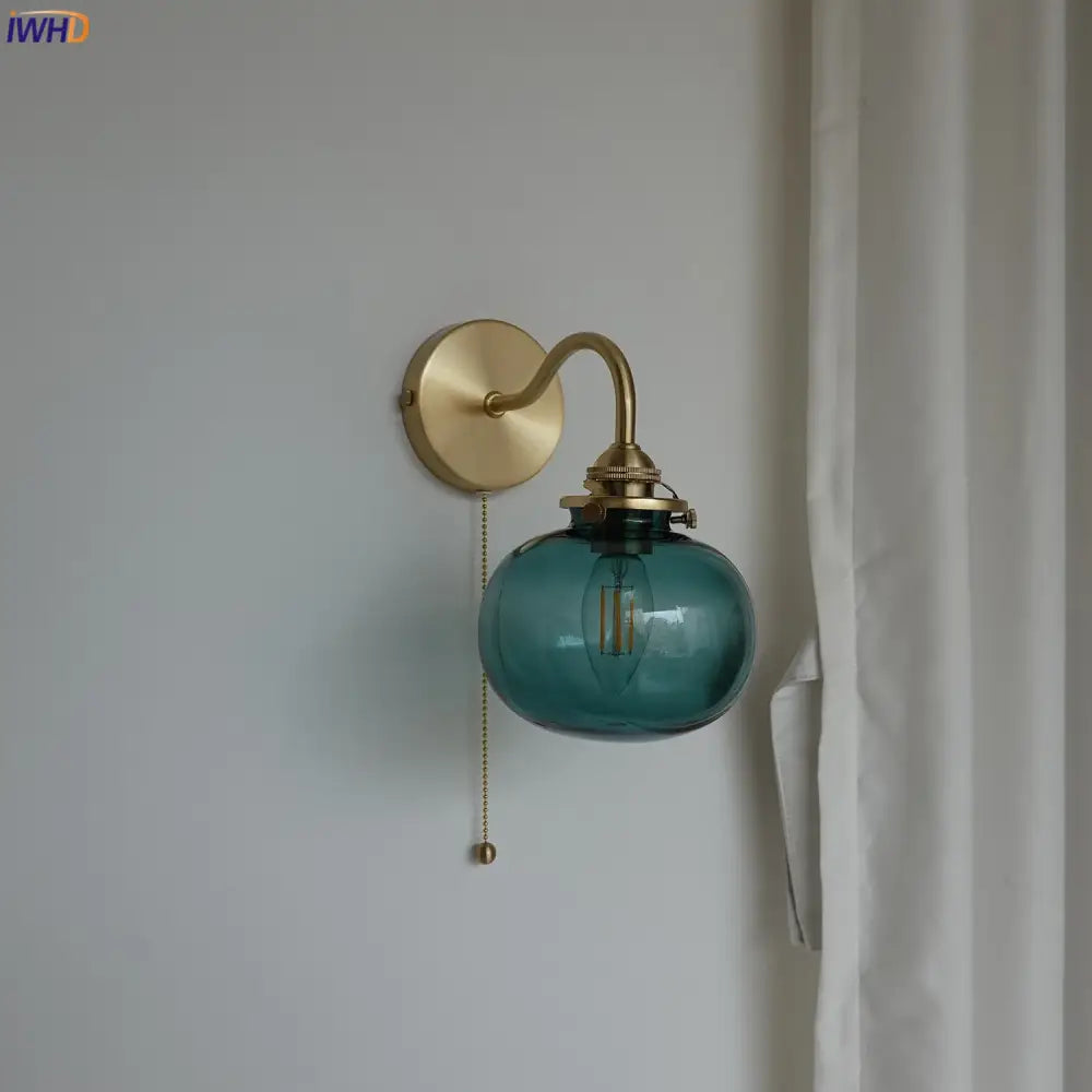 Modern brass and blue glass ball wall sconce with pull chain bedroom