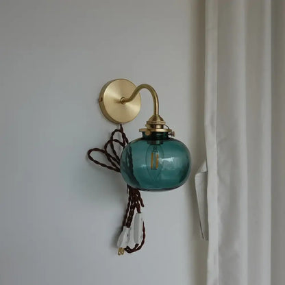 Modern brass and blue glass ball wall sconce with pull chain bedroom