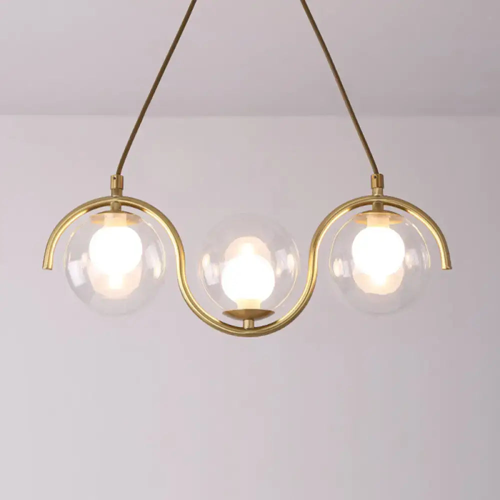 Modern brass and clear glass globe pendant light kitchen fixture
