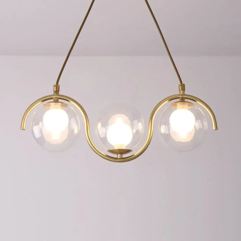 Modern brass and clear glass globe pendant light kitchen fixture