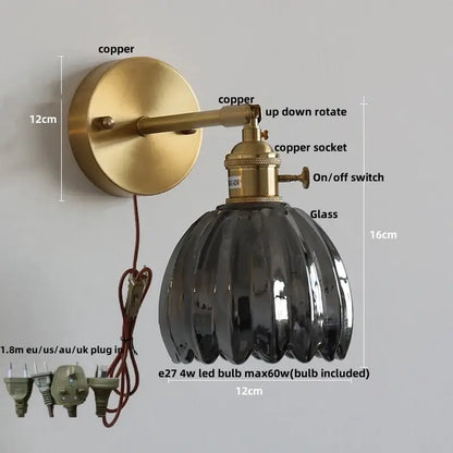 Modern brass and clear glass wall lights – bedroom rotating sconce
