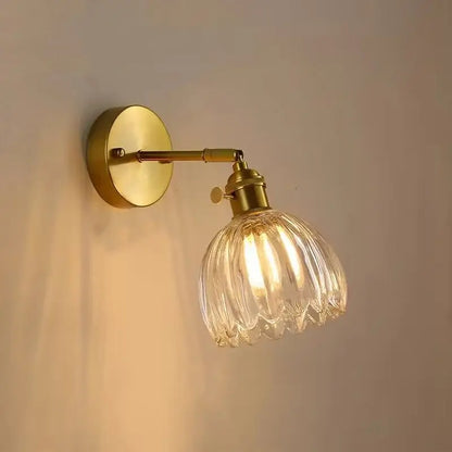 Modern brass and clear glass wall lights – bedroom rotating sconce