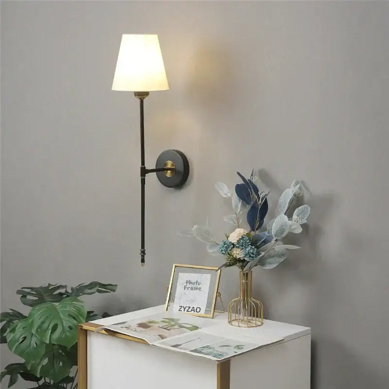 Modern brass and cream fabric led wall lamps for bedroom