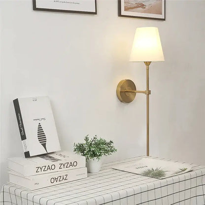 Modern brass and cream fabric led wall lamps for bedroom