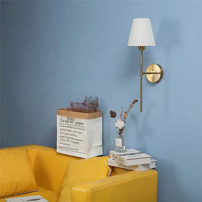 Modern brass and cream fabric led wall lamps for bedroom
