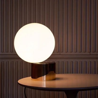Modern brass and glass circular table lamp for bedroom