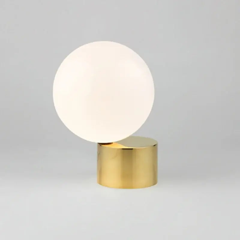 Modern brass and glass circular table lamp for bedroom