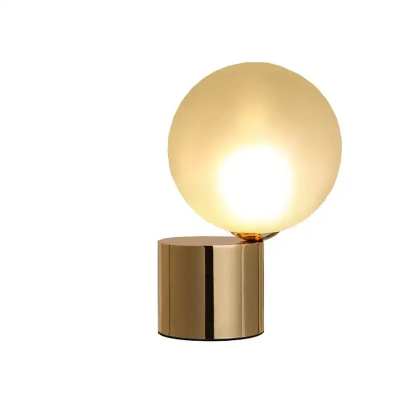 Modern brass and glass circular table lamp for bedroom