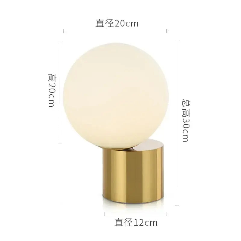 Modern brass and glass circular table lamp for bedroom