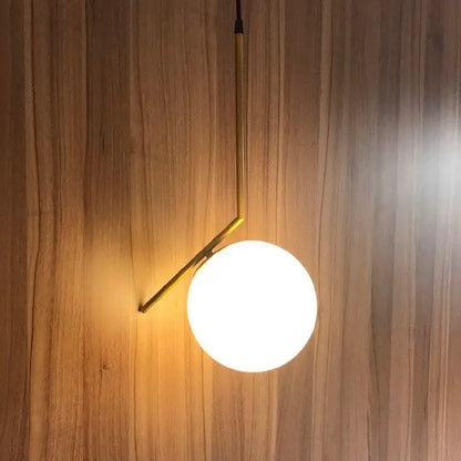 Modern brass and frosted glass ball pendant light dining room fixture