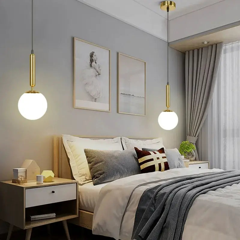 Modern brass and frosted glass ball pendant light for dining room