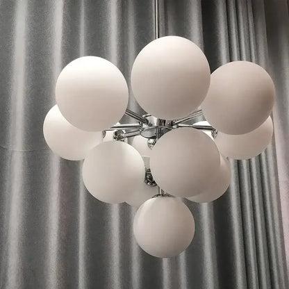 Modern brass and frosted glass chandelier for living room dining decor