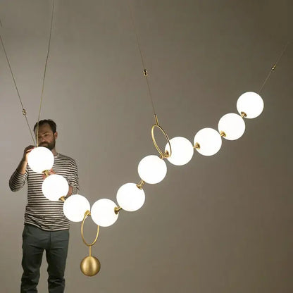 Modern brass and glass ball pendant light – dining room chandelier