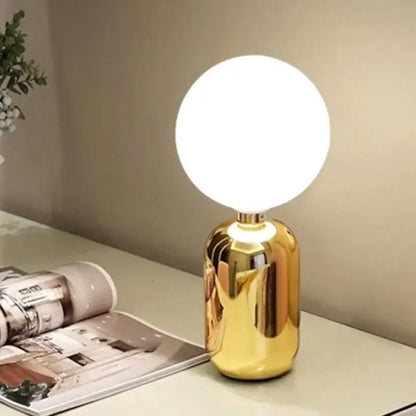Modern brass and glass desk lamp for bedroom with spherical shade