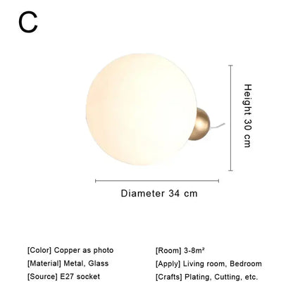 Modern brass and glass desk lamp for bedroom with spherical shade