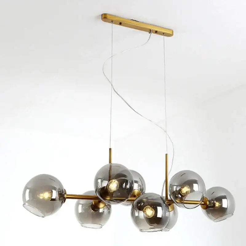 Modern brass and gray glass pendant lights for kitchen dining room