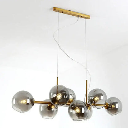 Modern brass and gray glass pendant lights for kitchen dining room