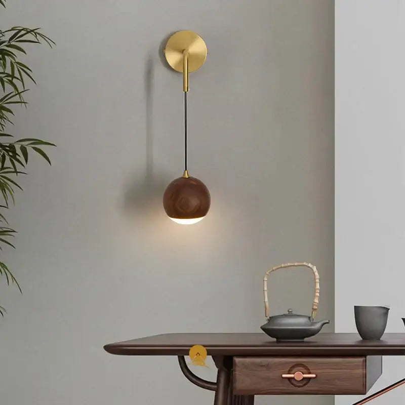 Modern brass and walnut wood wall sconce – bedroom sphere light