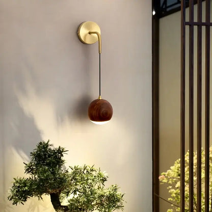 Modern brass and walnut wood wall sconce – bedroom sphere light