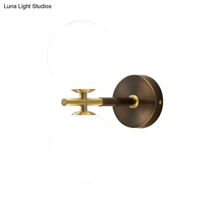 Modern brass and white glass wall sconce – bedroom globe light