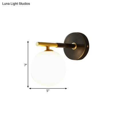 Modern brass and white glass wall sconce – bedroom globe light
