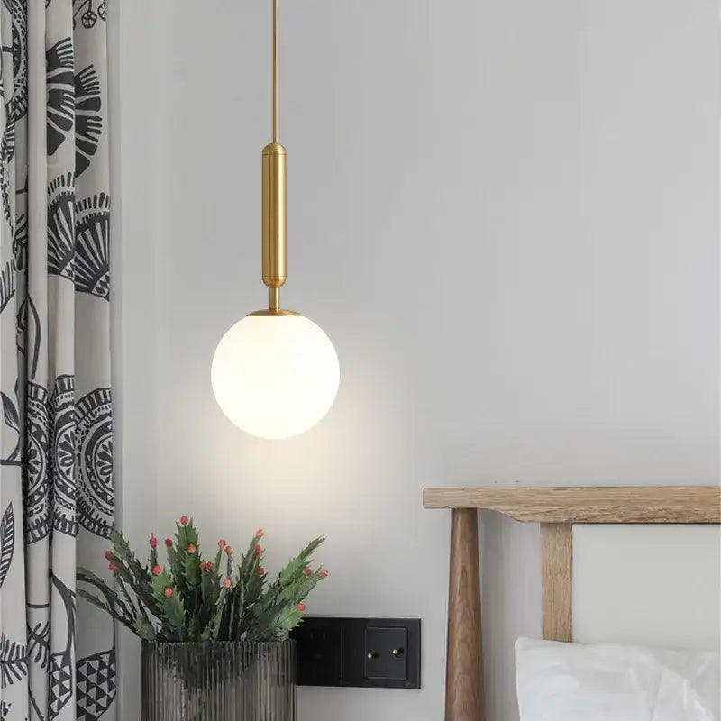 Modern brass & black glass ball pendant light for dining room