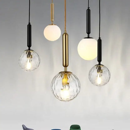 Modern brass & black glass ball pendant light for dining room