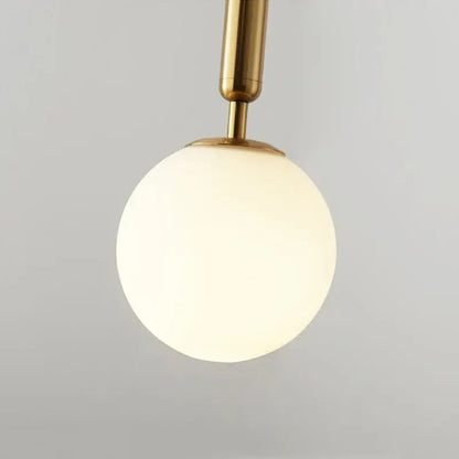 Modern brass & black glass ball pendant light for dining room