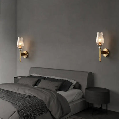 Modern brass diamond wall light with lattice glass shade bedroom