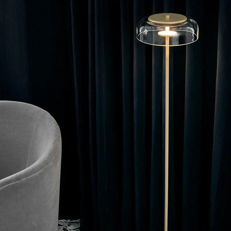 Modern brass floor lamp with glass lampshade for living room