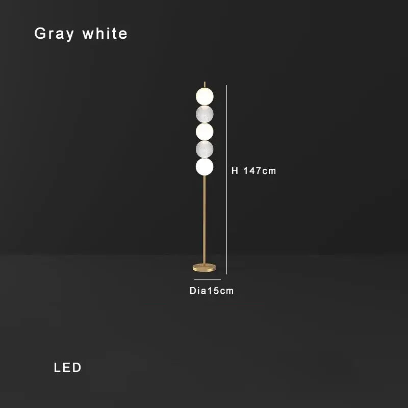 Modern brass floor lamp with six spheres for living room decor