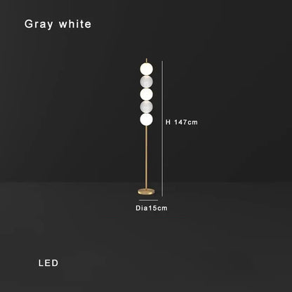 Modern brass floor lamp with six spheres for living room decor