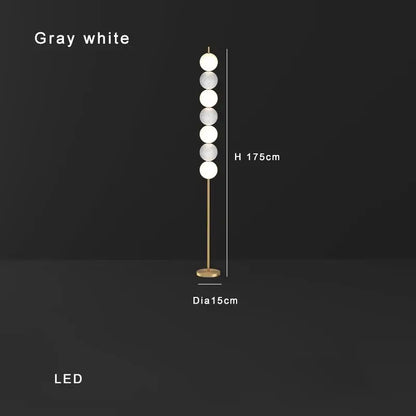 Modern brass floor lamp with six spheres for living room decor