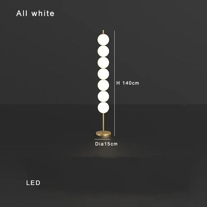 Modern brass floor lamp with six spheres for living room decor
