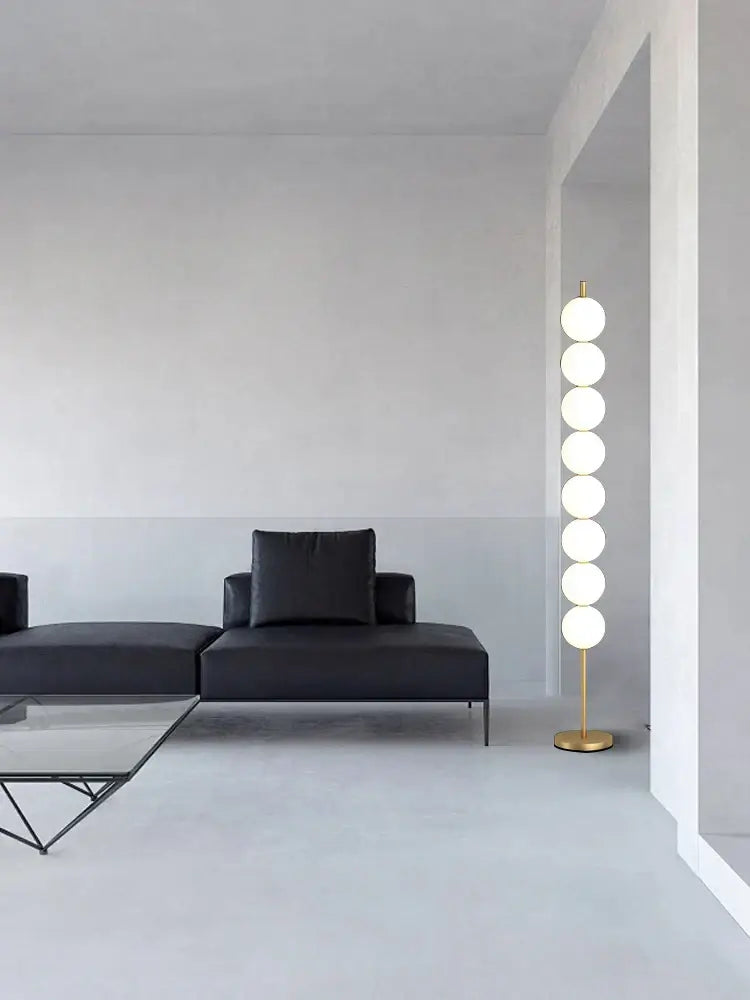 Modern brass floor lamp with six spheres for living room decor