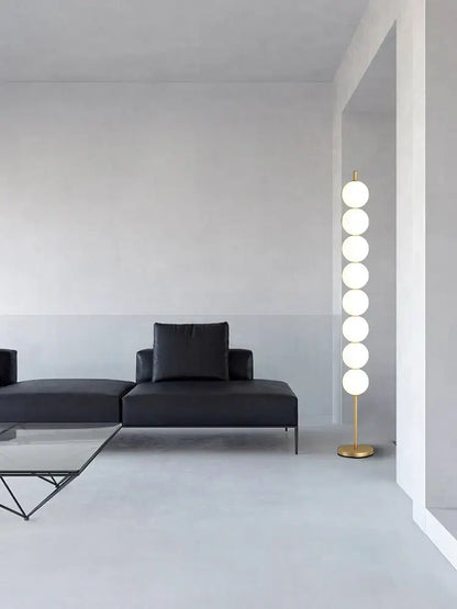 Modern brass floor lamp with six spheres for living room decor