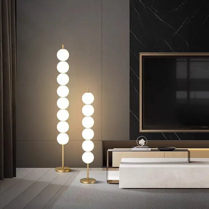 Modern brass floor lamp with six spheres for living room decor