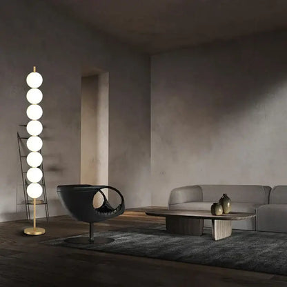 Modern brass floor lamp with six spheres for living room decor