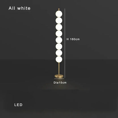 Modern brass floor lamp with six spheres for living room decor