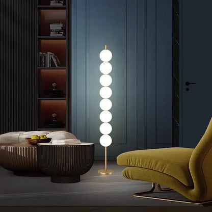 Modern brass floor lamp with six spheres for living room decor