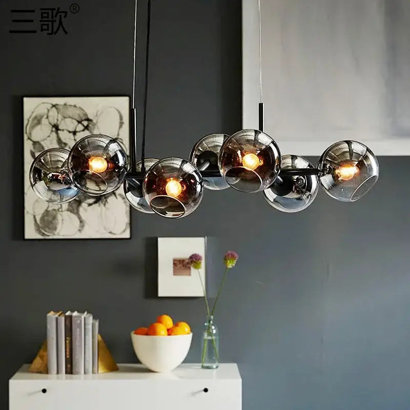 Modern brass glass ball pendant light for kitchen decor