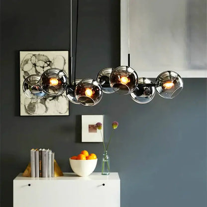 Modern brass glass ball pendant light for kitchen decor