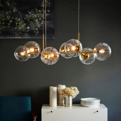 Modern brass glass ball pendant light for kitchen decor
