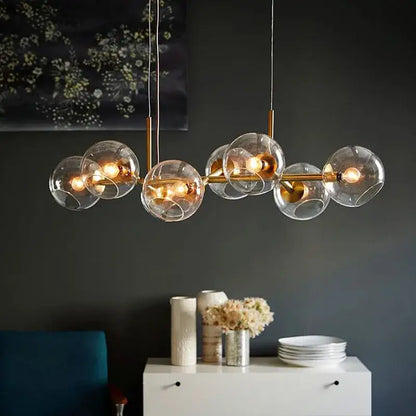 Modern brass glass ball pendant light for kitchen decor