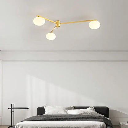 Modern brass glass ceiling lamp with frosted globes for living room